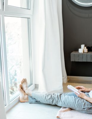Man reading book in the bedroom